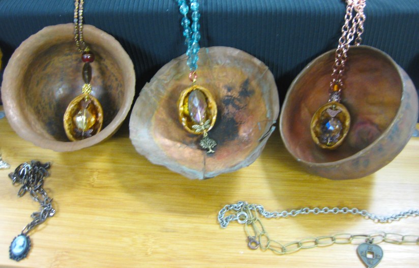 walnut necklaces in copper bowls